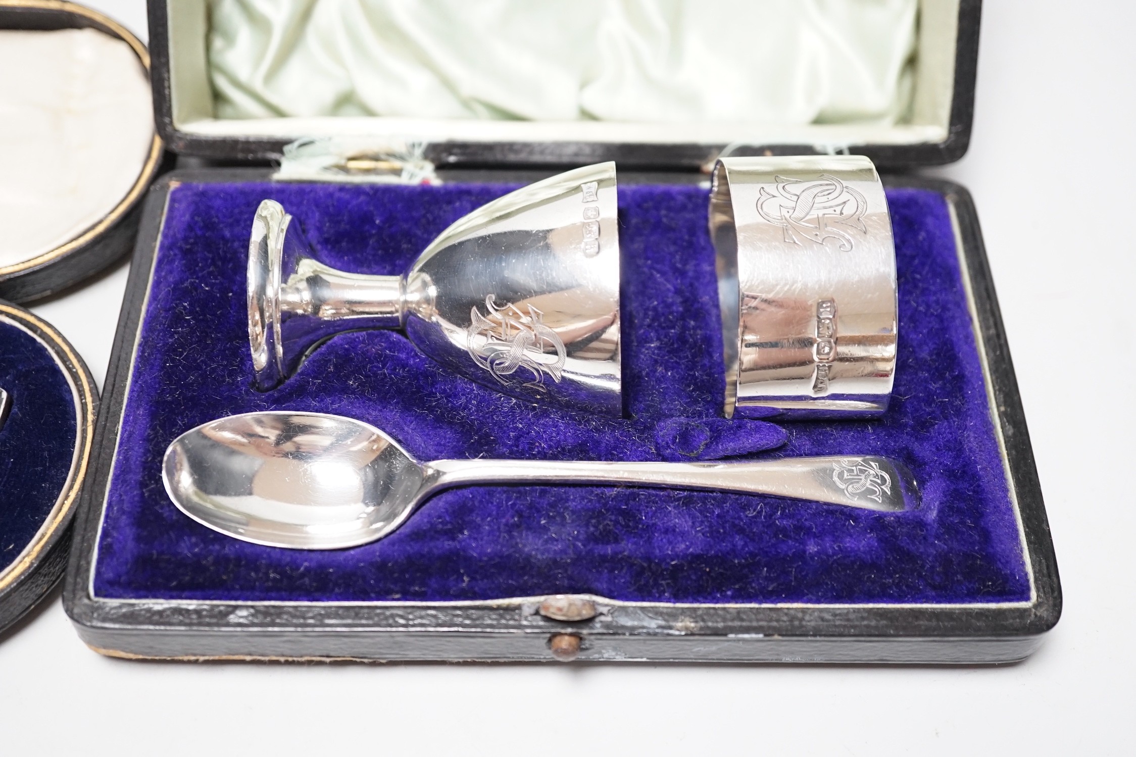 A cased George V silver christening trio, by Walker & Hall, Sheffield, 1925 and a cased silver christening spoon & fork, Henry Wigful, Sheffield, 1925.